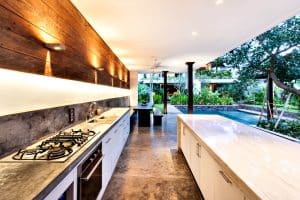 kitchen by the garden with countertops, appliance and lightings