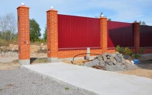 new construction of metal and concrete fence
